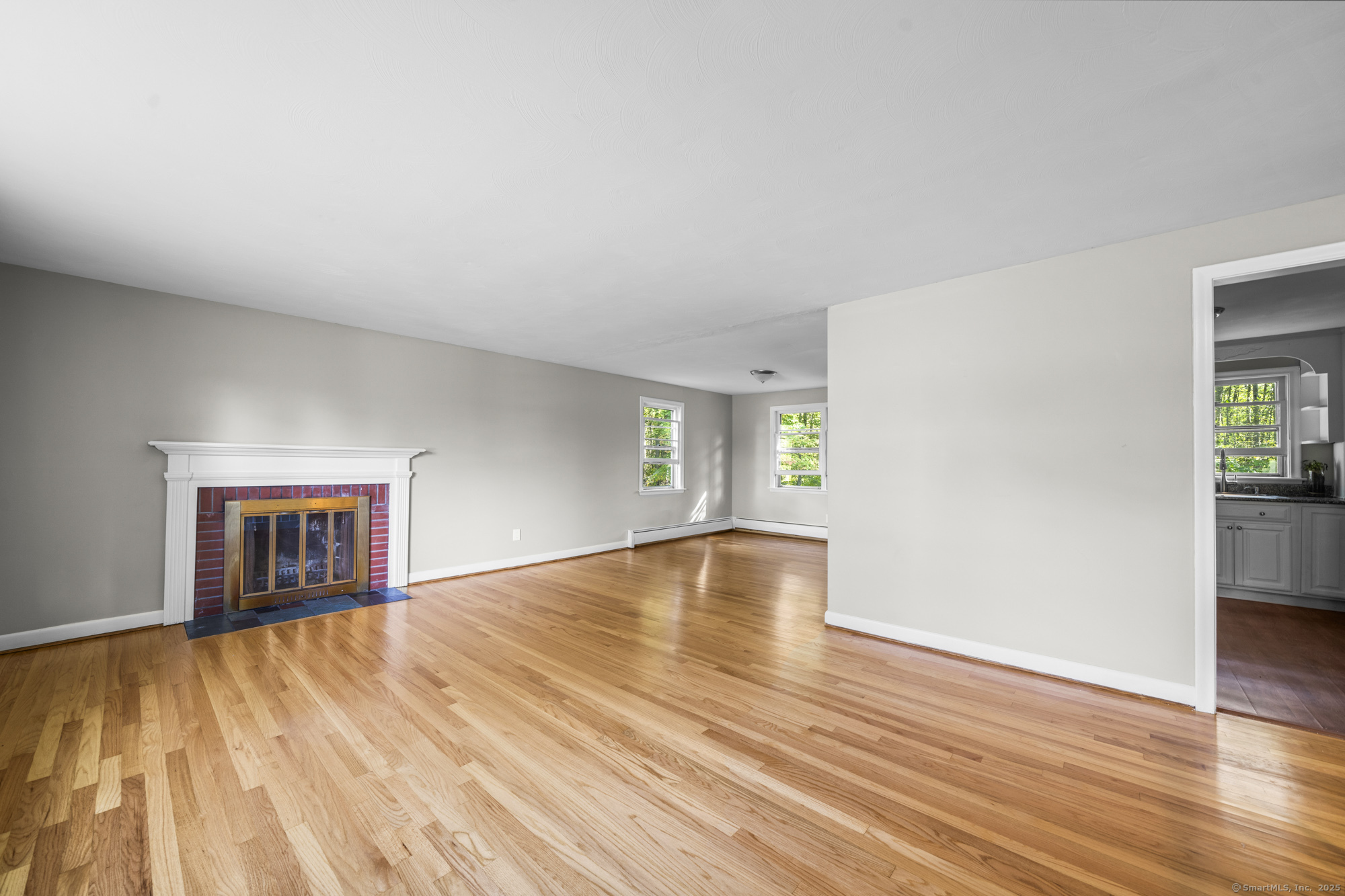 779 Bridge Street Suffield, CT 06078 - Photo 4 of 35 a view of empty room with wooden floor and fan