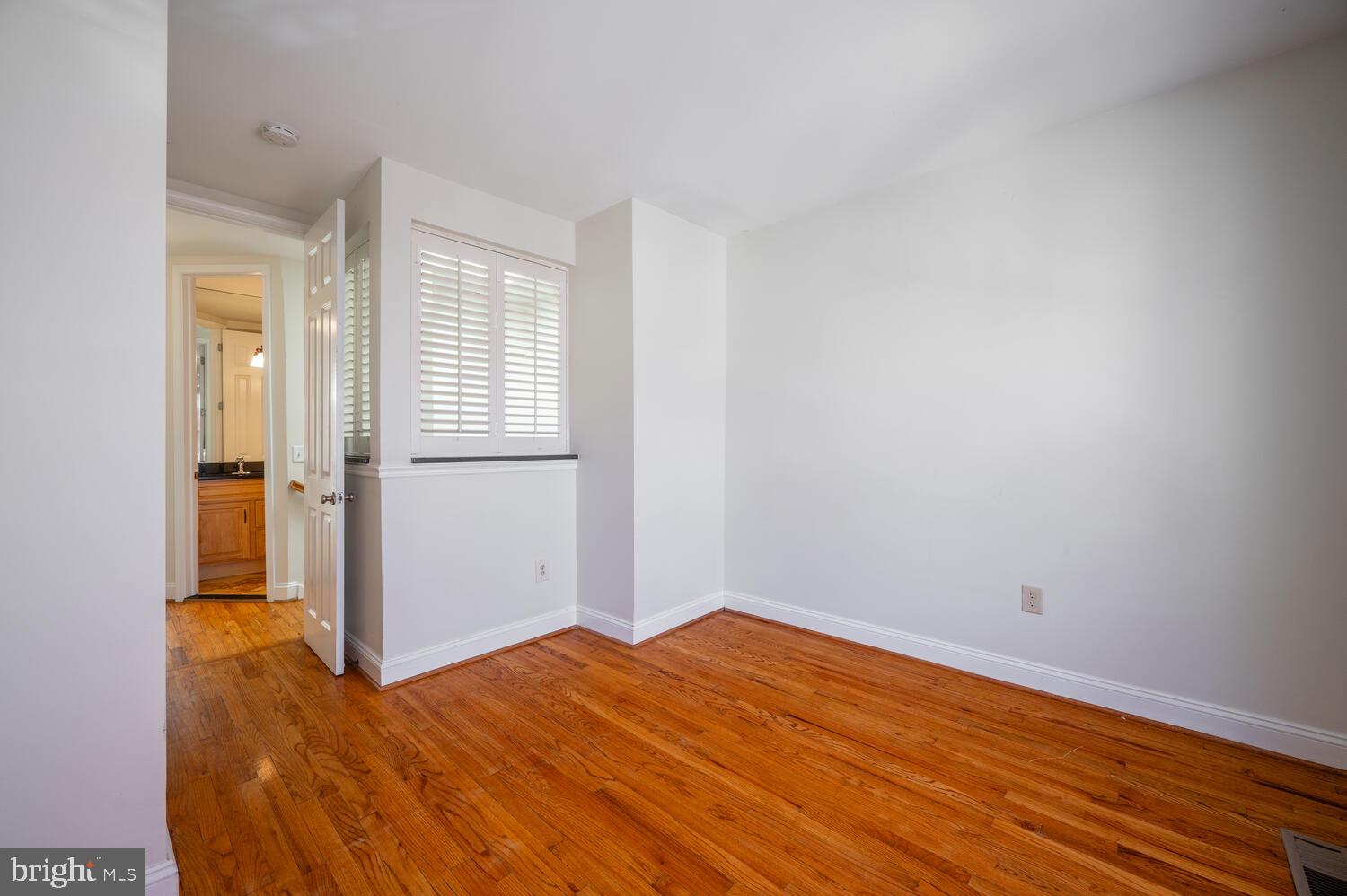 613 14th Place Northeast Washington, DC 20002 - Photo 14 of 31 a view of empty room with wooden floor and fan