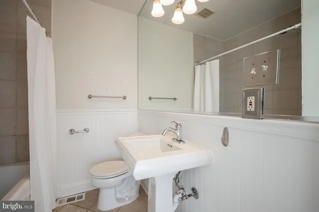 a bathroom with a tub and shower