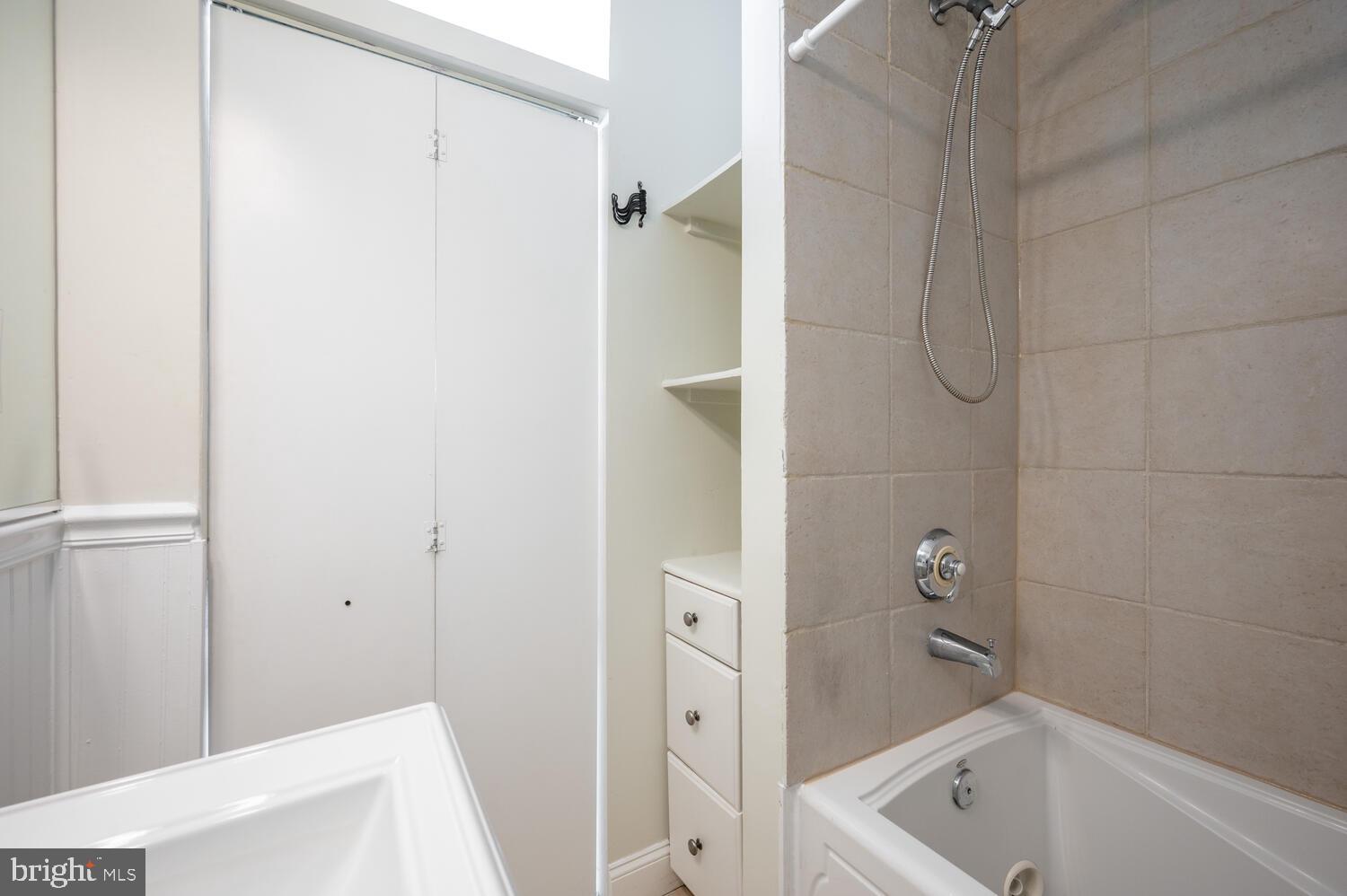 613 14th Place Northeast Washington, DC 20002 - Photo 20 of 31 a bathroom with a tub and shower