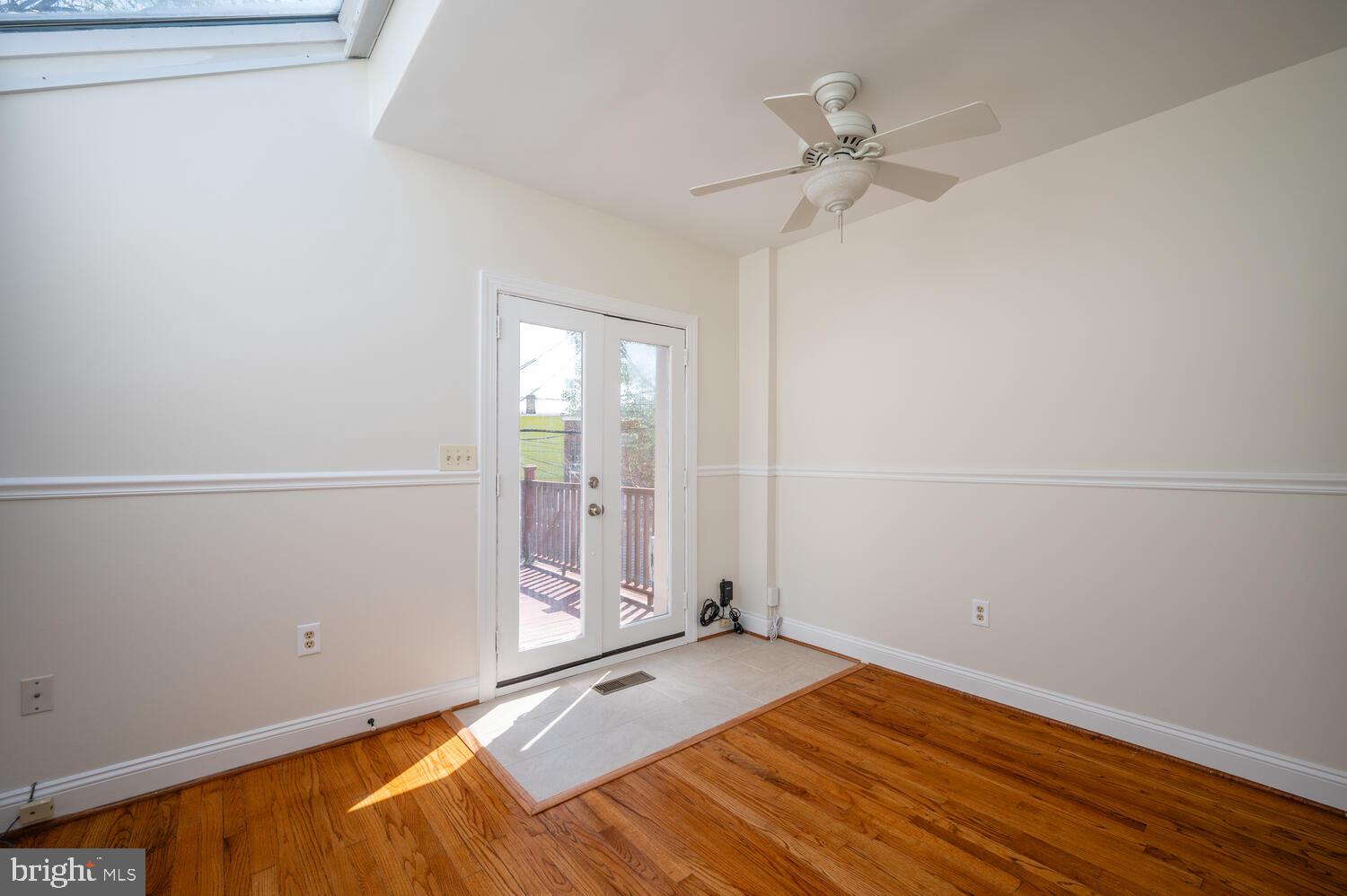 613 14th Place Northeast Washington, DC 20002 - Photo 21 of 31 a view of a room with wooden floor and a ceiling fan