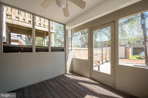 a view of a balcony with a tree