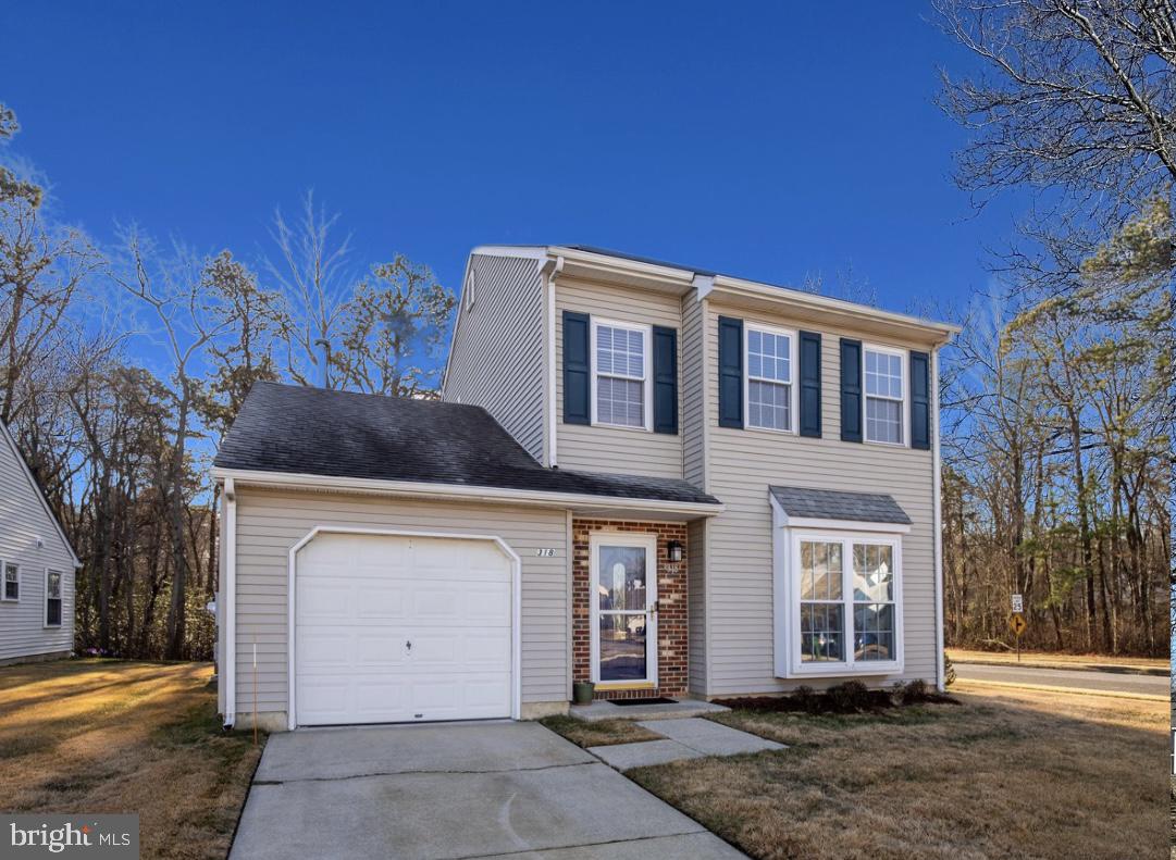 318 Holiday City Boulevard Williamstown, NJ 08094 - Photo 1 of 21 a front view of a house with a yard