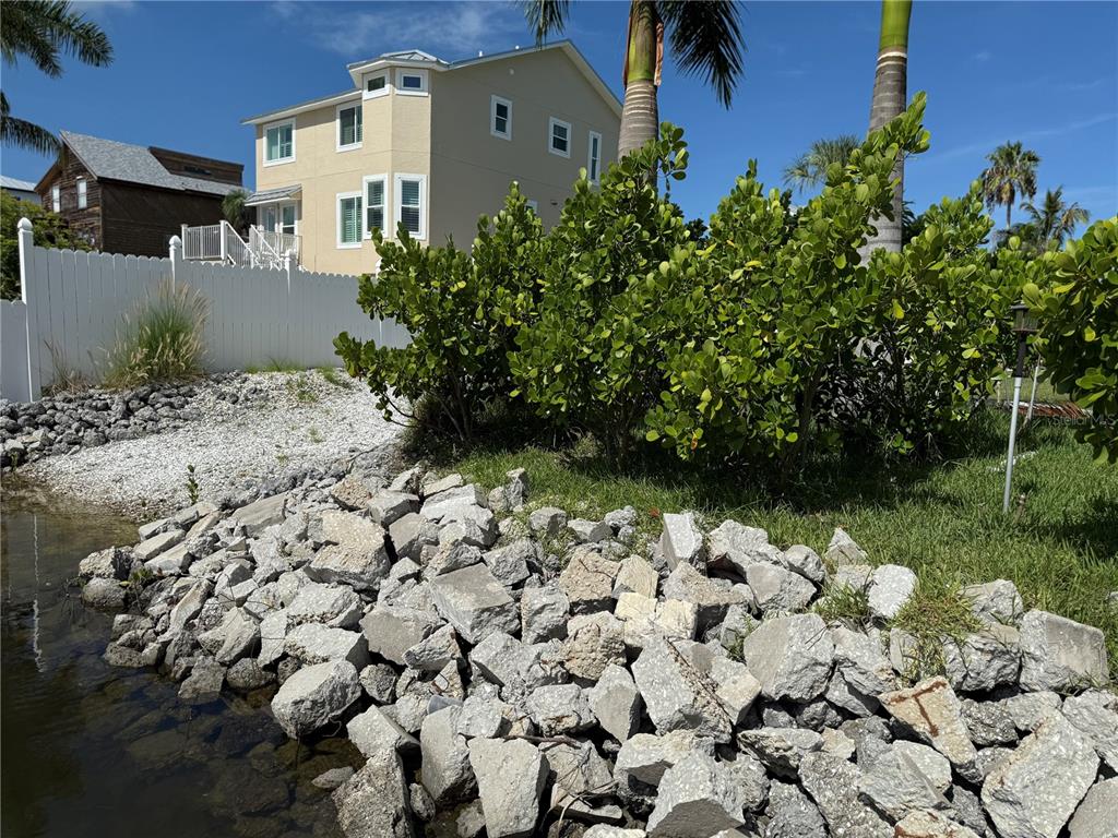 124 Burns Road Terra Ceia, FL 34250 - Photo 9 of 12 a backyard of a house with lots of green space