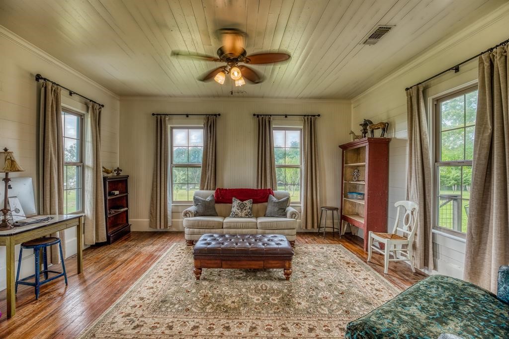 6900 Schroeder Road Brenham, TX 77833 - Photo 11 of 31 a living room with furniture and a large window