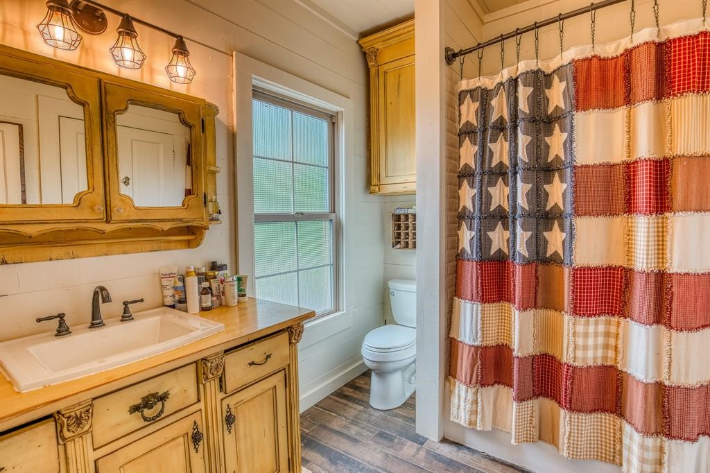 6900 Schroeder Road Brenham, TX 77833 - Photo 13 of 31 a spacious bathroom with a sink and a mirror