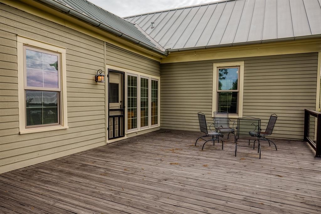 6900 Schroeder Road Brenham, TX 77833 - Photo 15 of 31 a backyard of a house with table and chairs