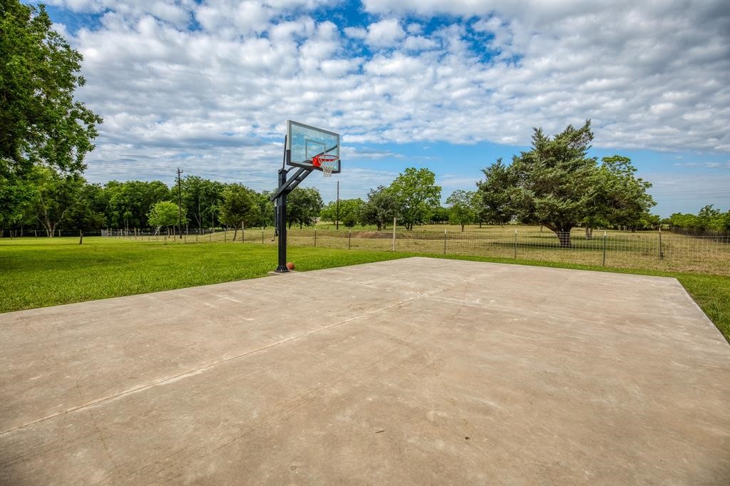 6900 Schroeder Road Brenham, TX 77833 - Photo 17 of 31 a view of a golf course with a play ground