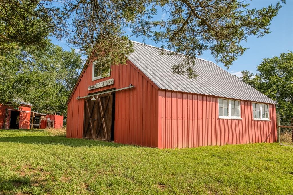 6900 Schroeder Road Brenham, TX 77833 - Photo 25 of 31 a view of a house with a yard