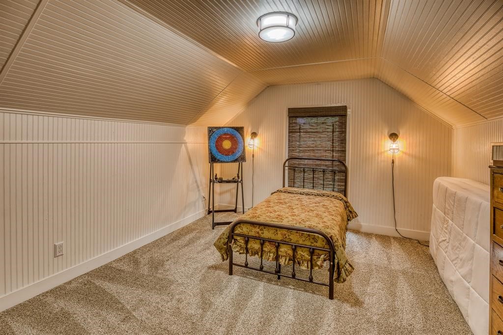 6900 Schroeder Road Brenham, TX 77833 - Photo 27 of 31 a bedroom with a bed and a window