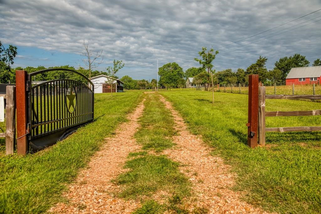 6900 Schroeder Road Brenham, TX 77833 - Photo 3 of 31 a view of a garden with a pathway