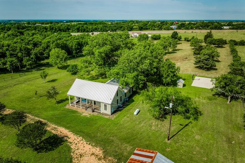 6900 Schroeder Road Brenham, TX 77833 - Photo 4 of 31 an aerial view of a house with a yard