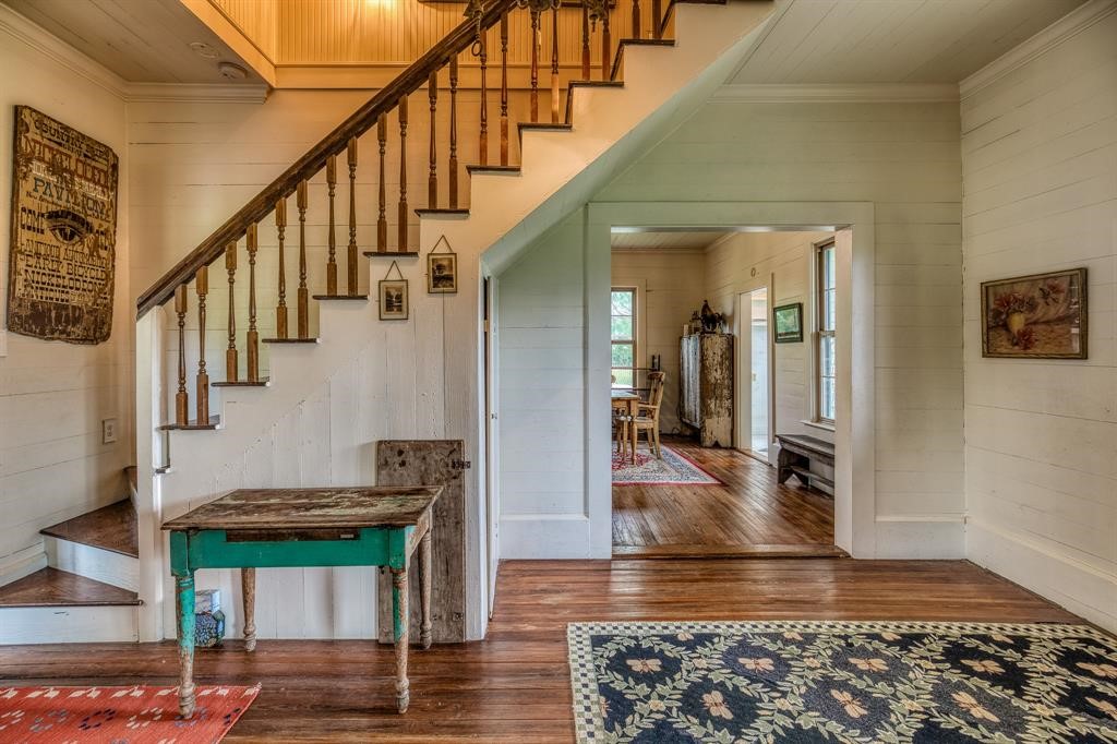 6900 Schroeder Road Brenham, TX 77833 - Photo 6 of 31 a view of entryway and hall with wooden floor