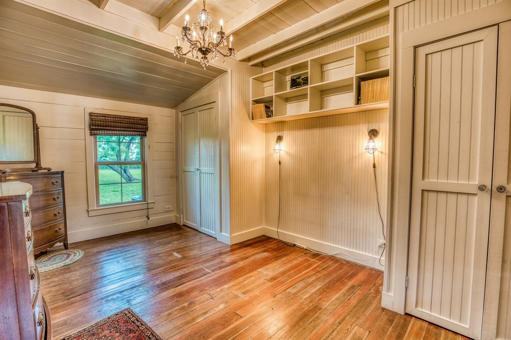 6900 Schroeder Road Brenham, TX 77833 - Photo 10 of 31 a view of empty room with wooden floor and fan