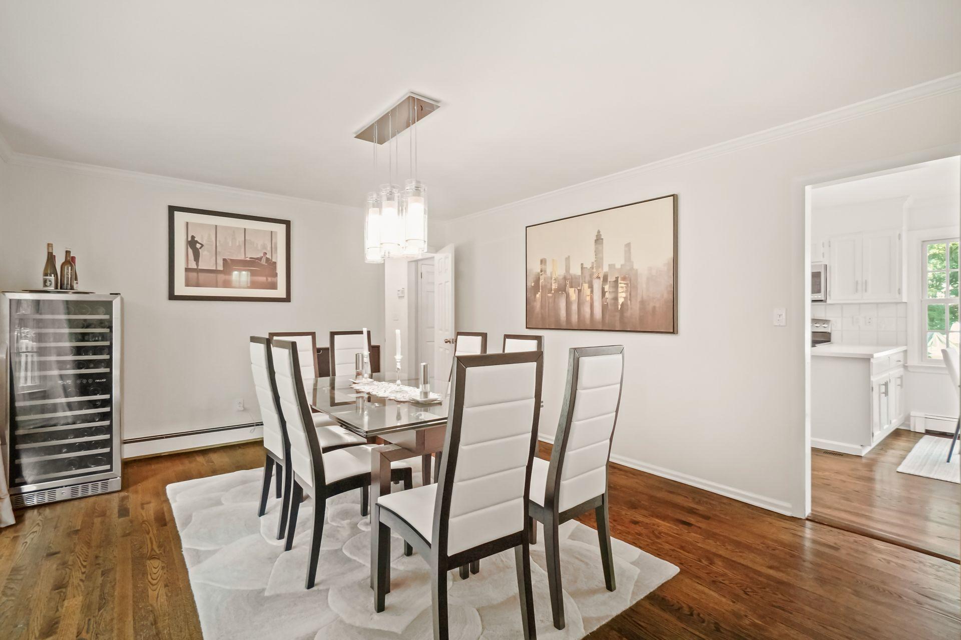231 Ponus Ridge Road New Canaan, CT 06840 - Photo 4 of 37 a dining room with furniture and wooden floor