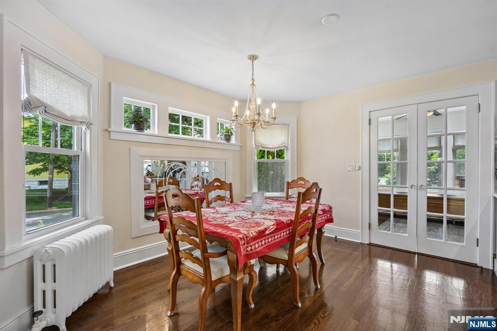 57 Oldis Street Rochelle Park, NJ 07662 - Photo 7 of 19 a dining room with furniture a chandelier and wooden floor