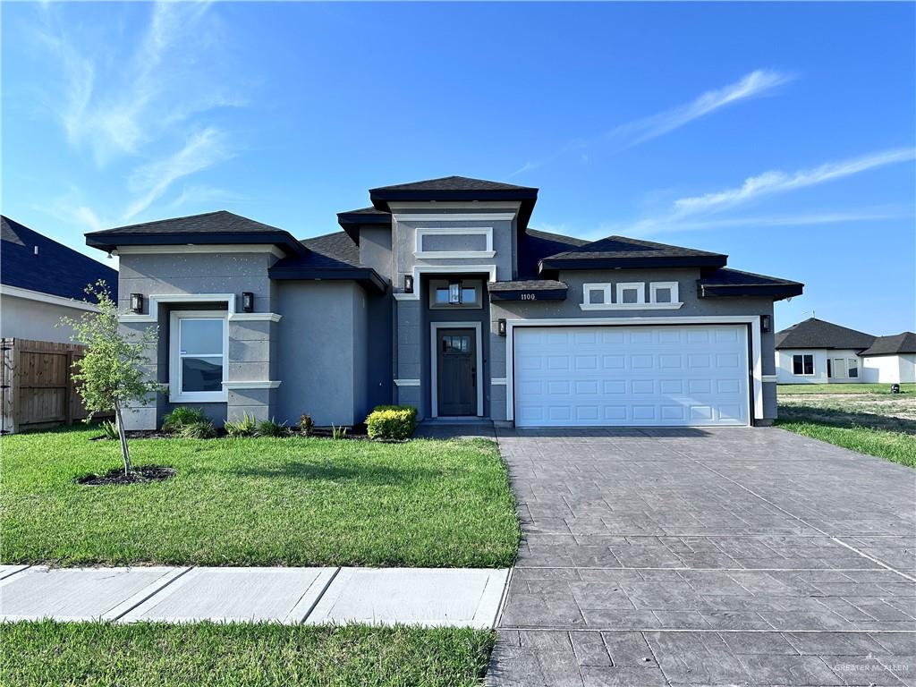 1100 Azalea Street Mission, TX 78573 - Photo 1 of 24 a front view of a house with a yard