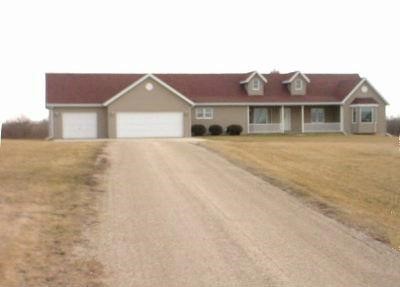 653 West Florence Road Freeport, IL 61032 - Photo 1 of 9 a front view of a house with a yard and garage