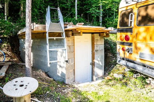 a view of a chairs and table in backyard