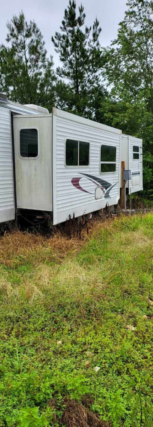 1882 Morris Road Holladay, TN 38341 - Photo 25 of 43 a view of a kitchen with a sink and microwave