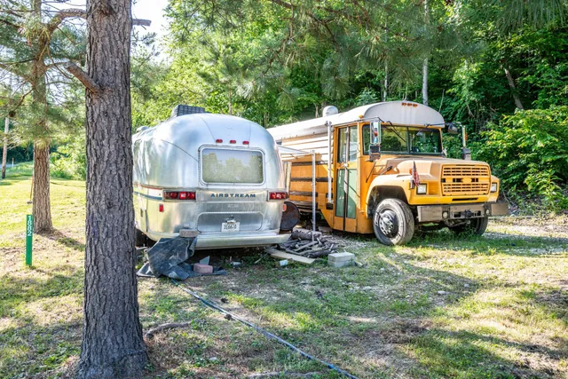 a view of a back yard with a table and chairs