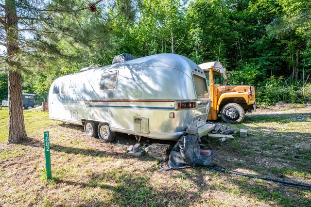 a view of a house with yard and sitting area