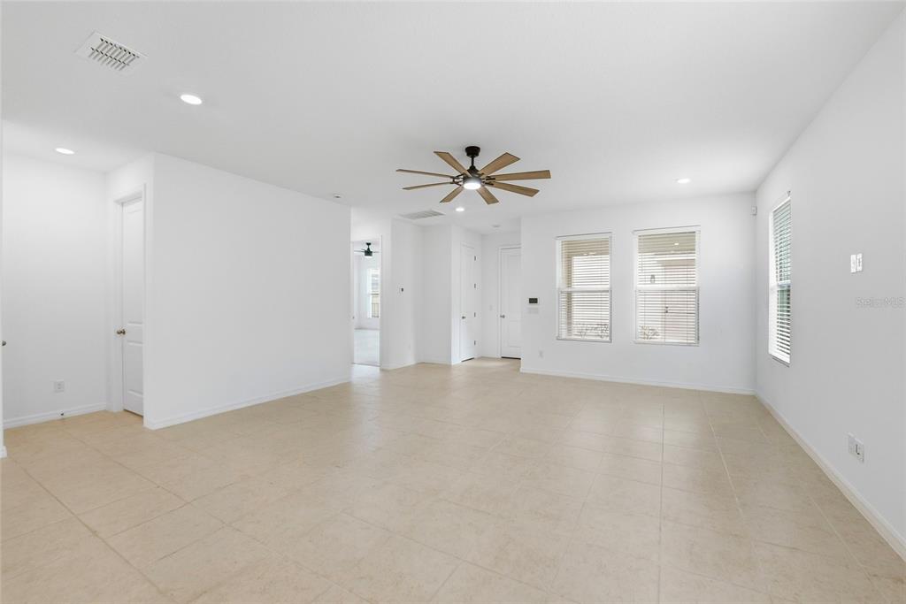 6550 Barnstorm Way St. Cloud, FL 34771 - Photo 18 of 35 a view of an empty room with a ceiling fan