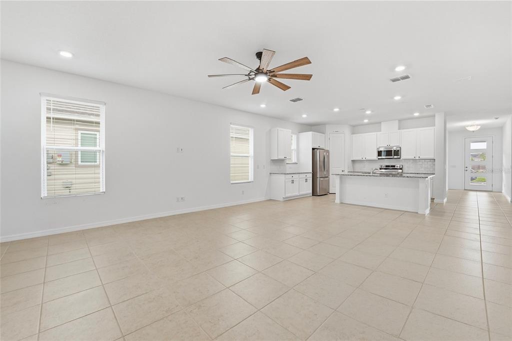 6550 Barnstorm Way St. Cloud, FL 34771 - Photo 20 of 35 a view of a kitchen with a stove top oven a sink and dishwasher