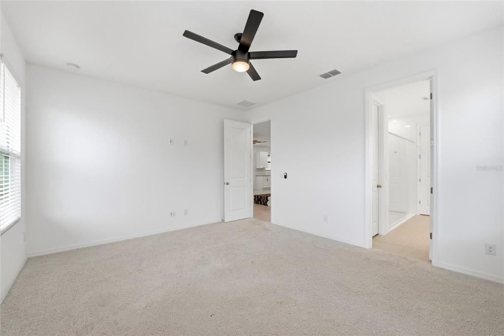 6550 Barnstorm Way St. Cloud, FL 34771 - Photo 22 of 35 a view of a livingroom with a ceiling fan