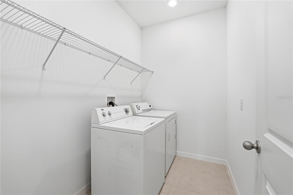 6550 Barnstorm Way St. Cloud, FL 34771 - Photo 27 of 35 a utility room with dryer and washer