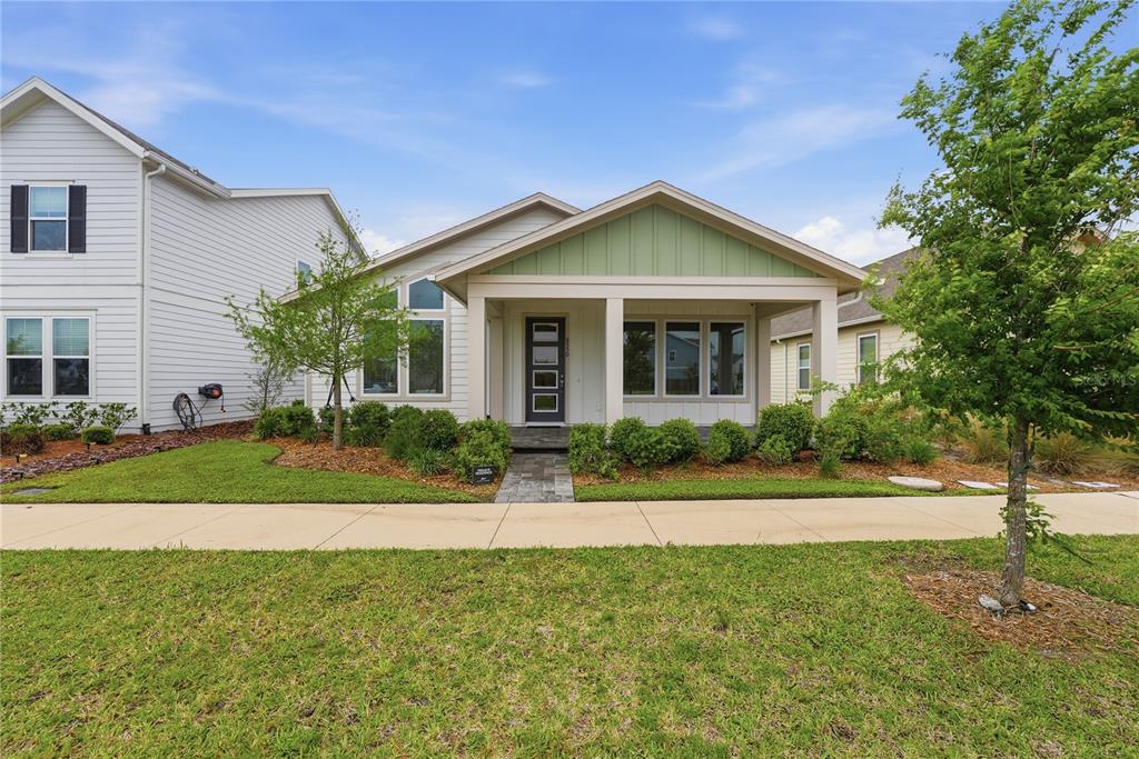 6550 Barnstorm Way St. Cloud, FL 34771 - Photo 3 of 35 a front view of a house with a yard