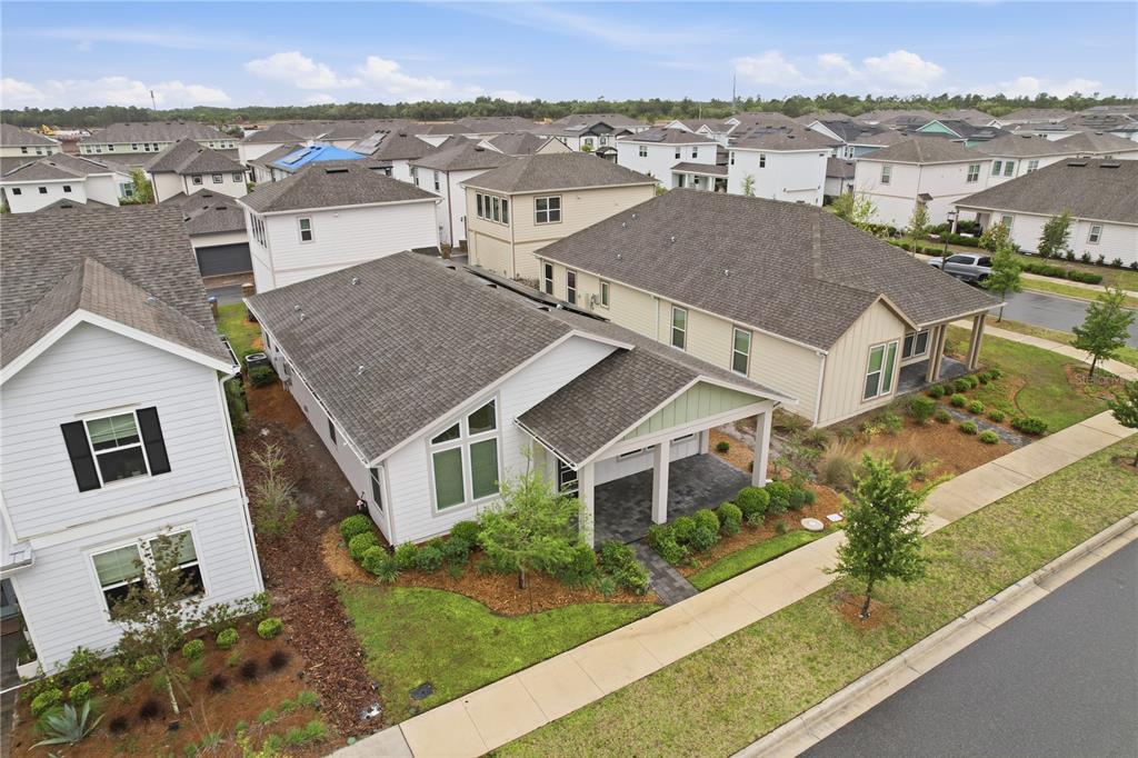 6550 Barnstorm Way St. Cloud, FL 34771 - Photo 33 of 35 an aerial view of a house with a yard
