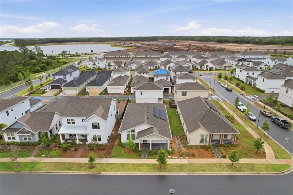 6550 Barnstorm Way St. Cloud, FL 34771 - Photo 34 of 35 an aerial view of residential houses with outdoor space and ocean view
