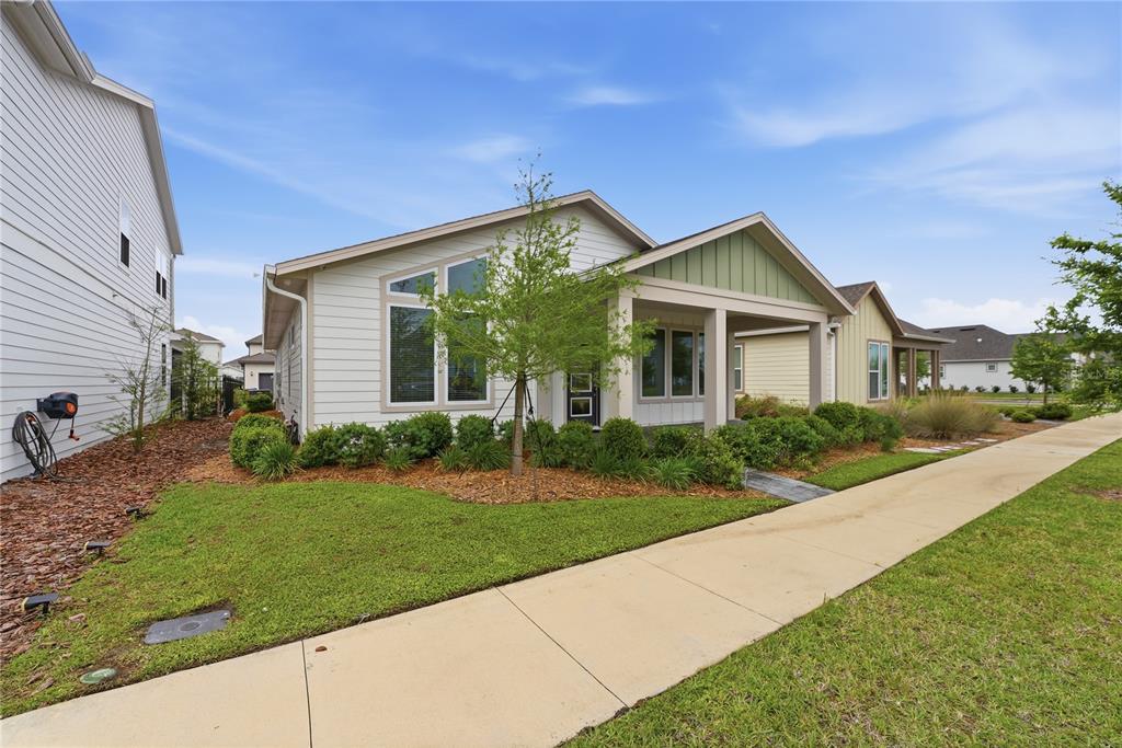 6550 Barnstorm Way St. Cloud, FL 34771 - Photo 4 of 35 a front view of a house with a yard