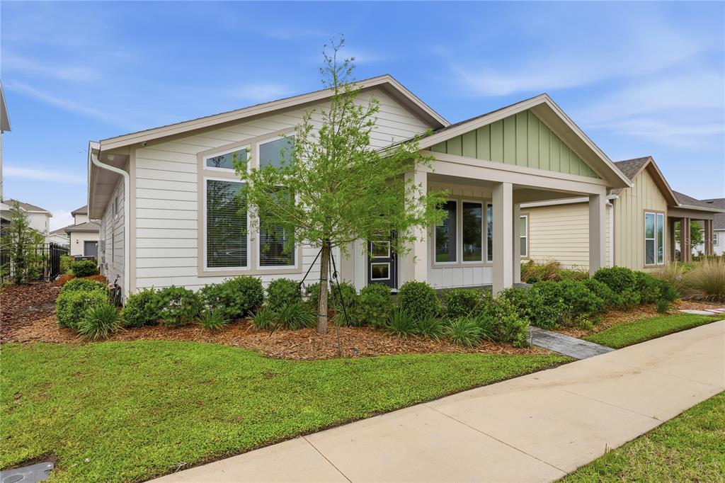 6550 Barnstorm Way St. Cloud, FL 34771 - Photo 5 of 35 a view of a house with yard and plants