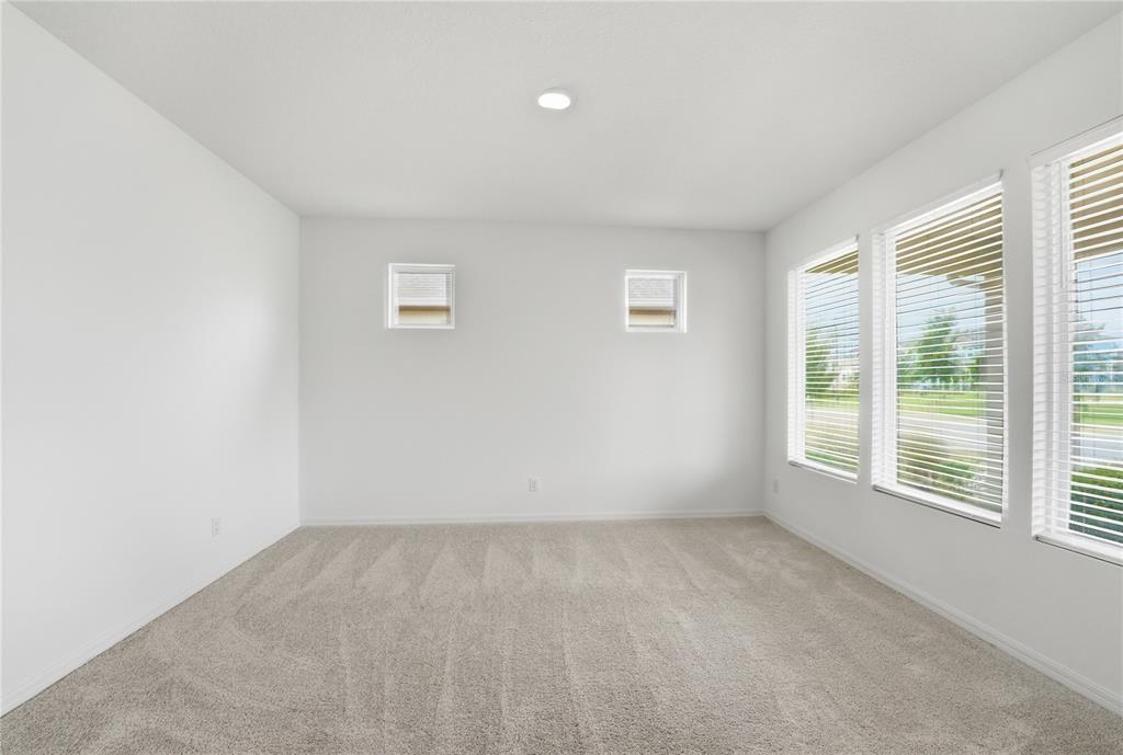 6550 Barnstorm Way St. Cloud, FL 34771 - Photo 8 of 35 an empty room with a window