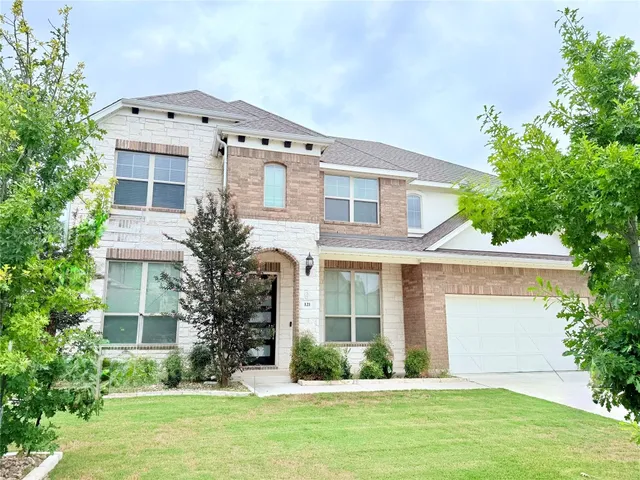 front view of a house with a yard