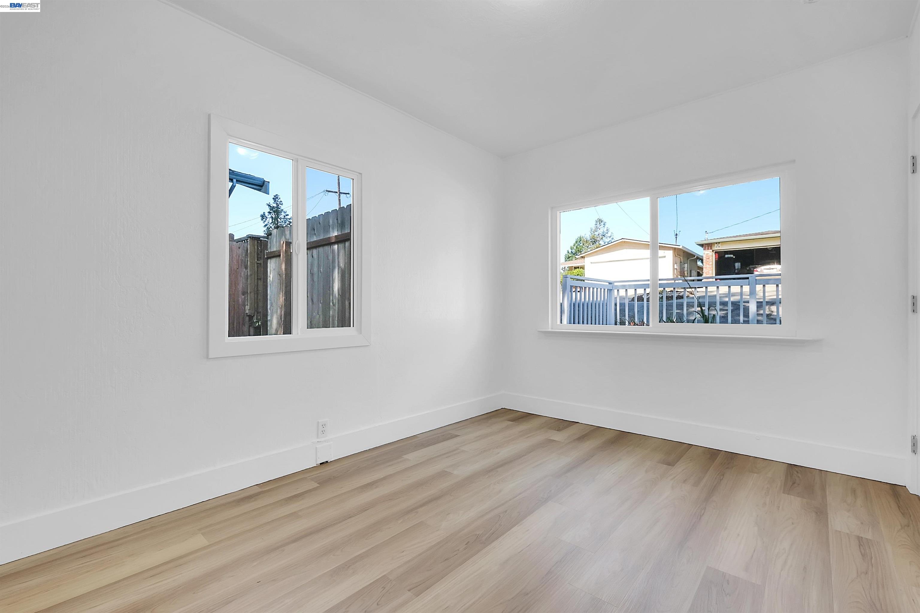 1467 Clay Street Hayward, CA 94541 - Photo 13 of 28 a view of an empty room with wooden floor and a window