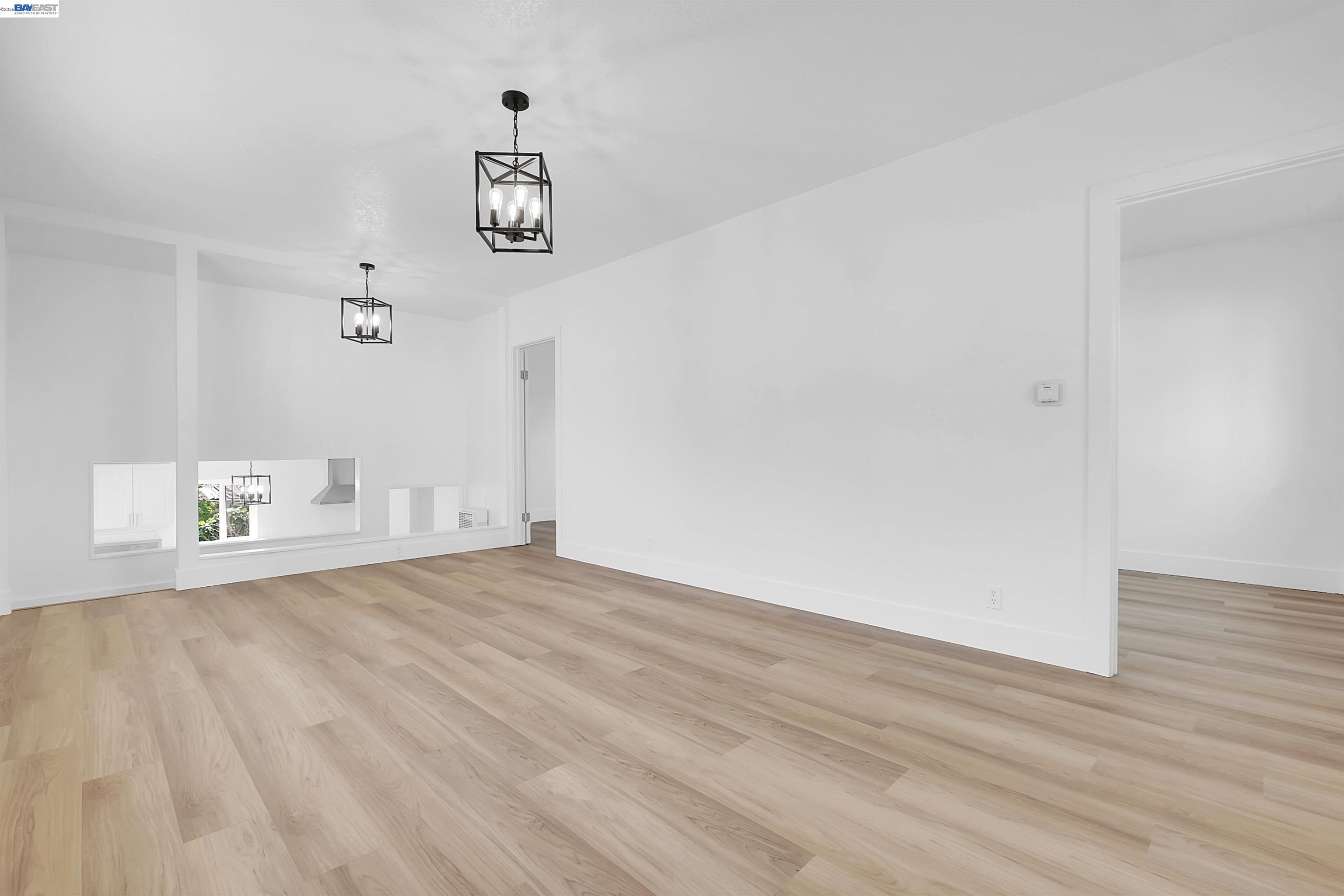 1467 Clay Street Hayward, CA 94541 - Photo 16 of 28 a view of empty room with wooden floor and ceiling fan