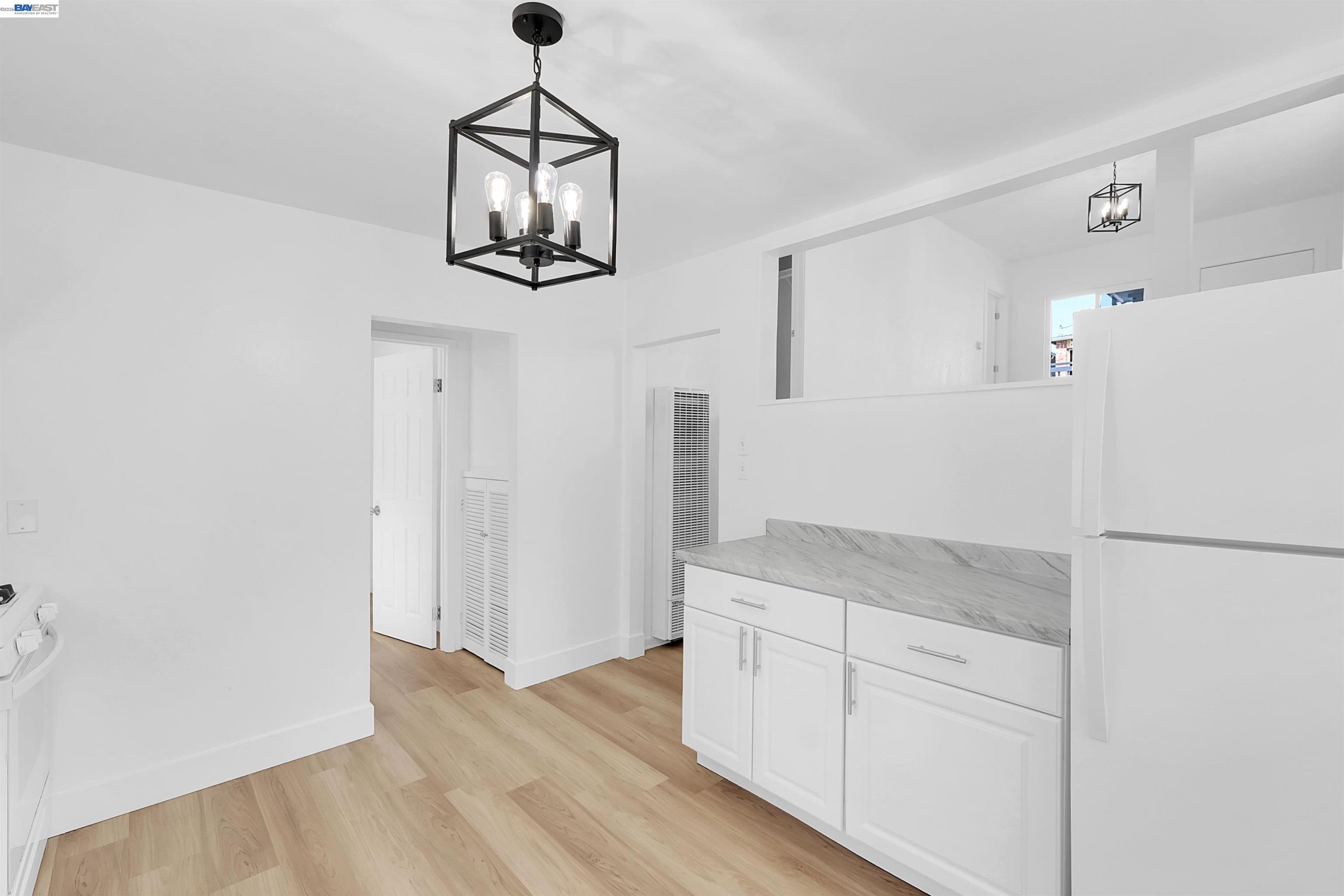 1467 Clay Street Hayward, CA 94541 - Photo 4 of 28 a kitchen with a refrigerator sink and cabinets