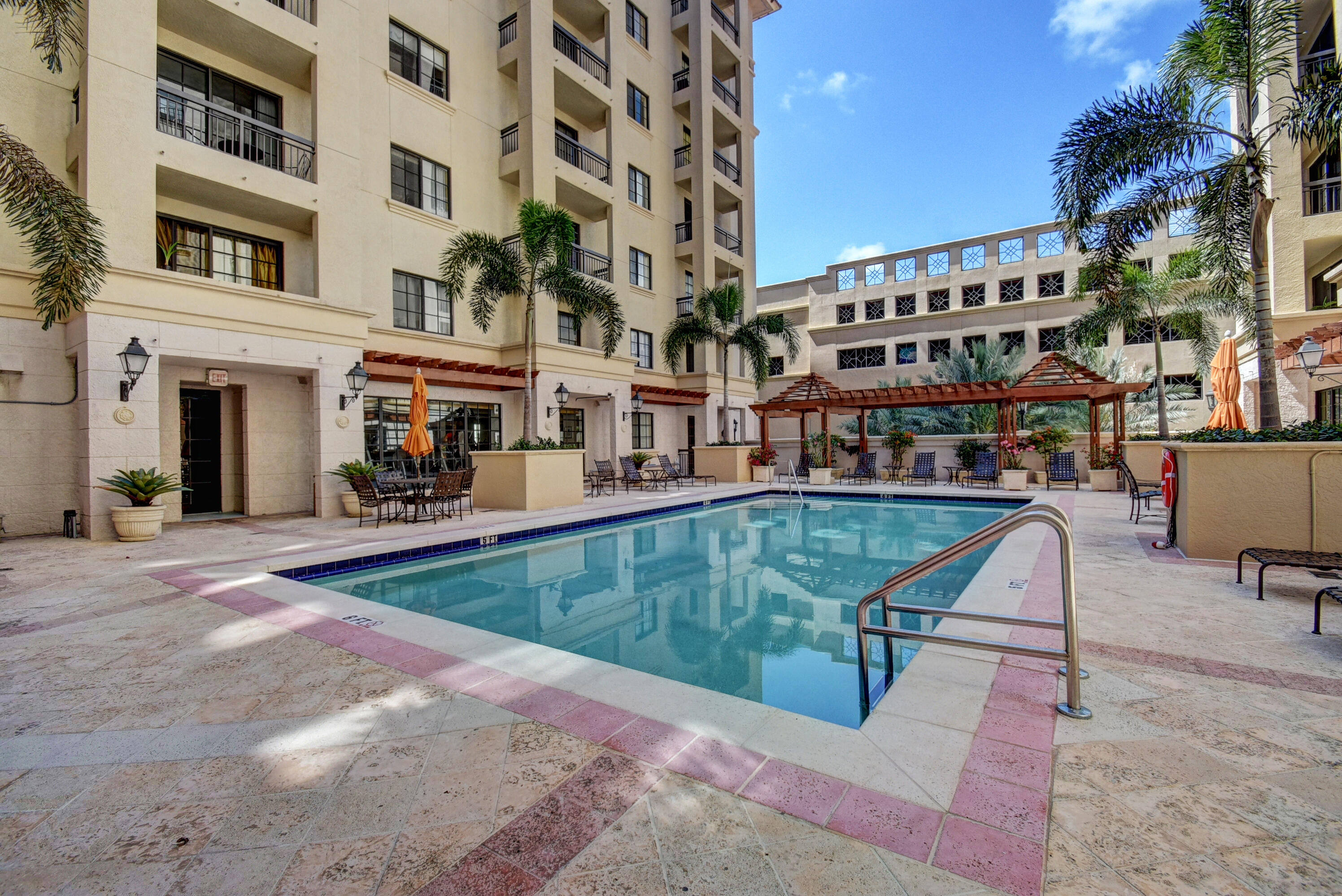 233 South Federal Highway, Unit UPH04 Boca Raton, FL 33432 - Photo 21 of 26 a view of a building with a swimming pool