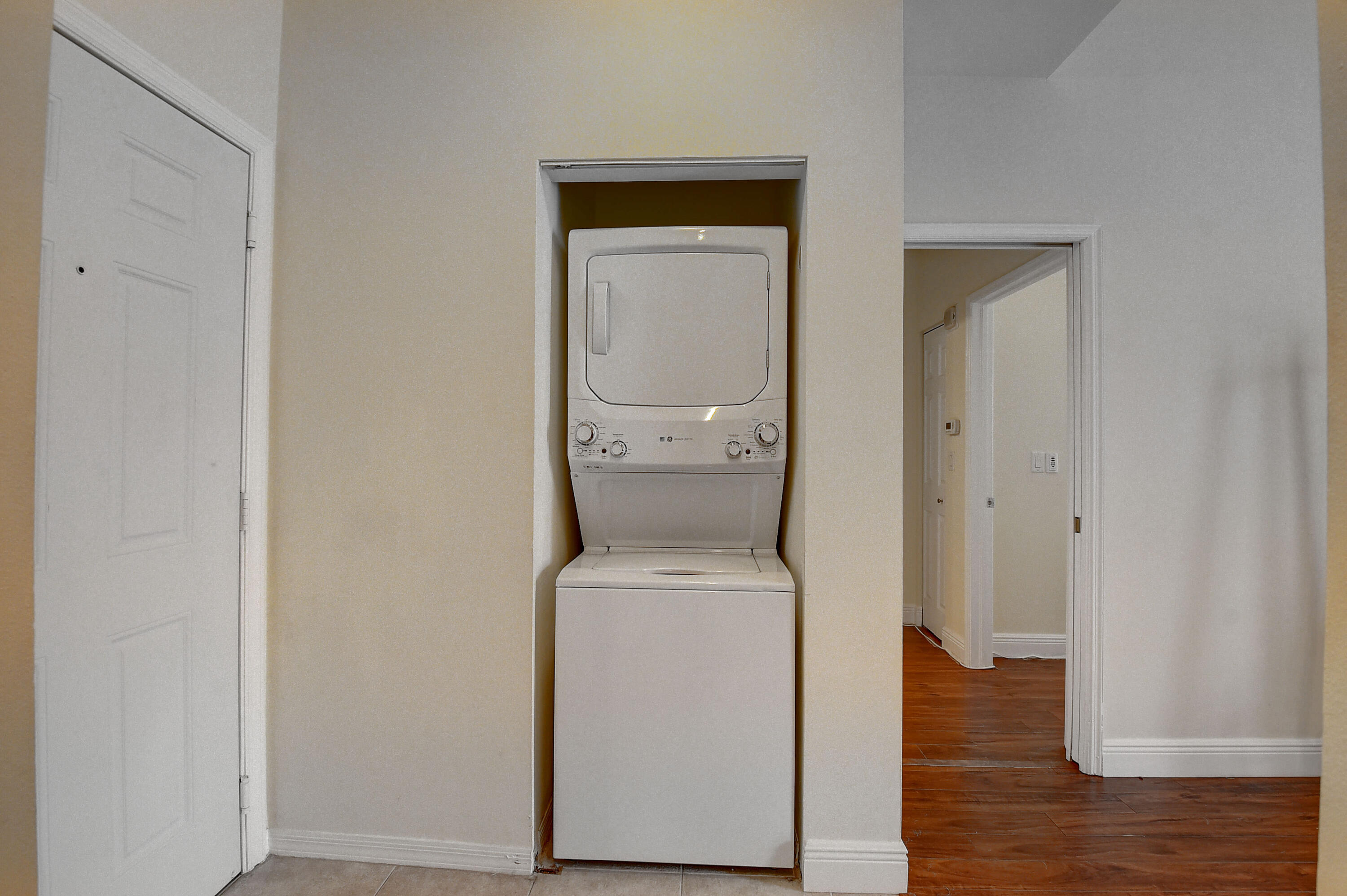 233 South Federal Highway, Unit UPH04 Boca Raton, FL 33432 - Photo 4 of 26 a utility room with dryer and washer