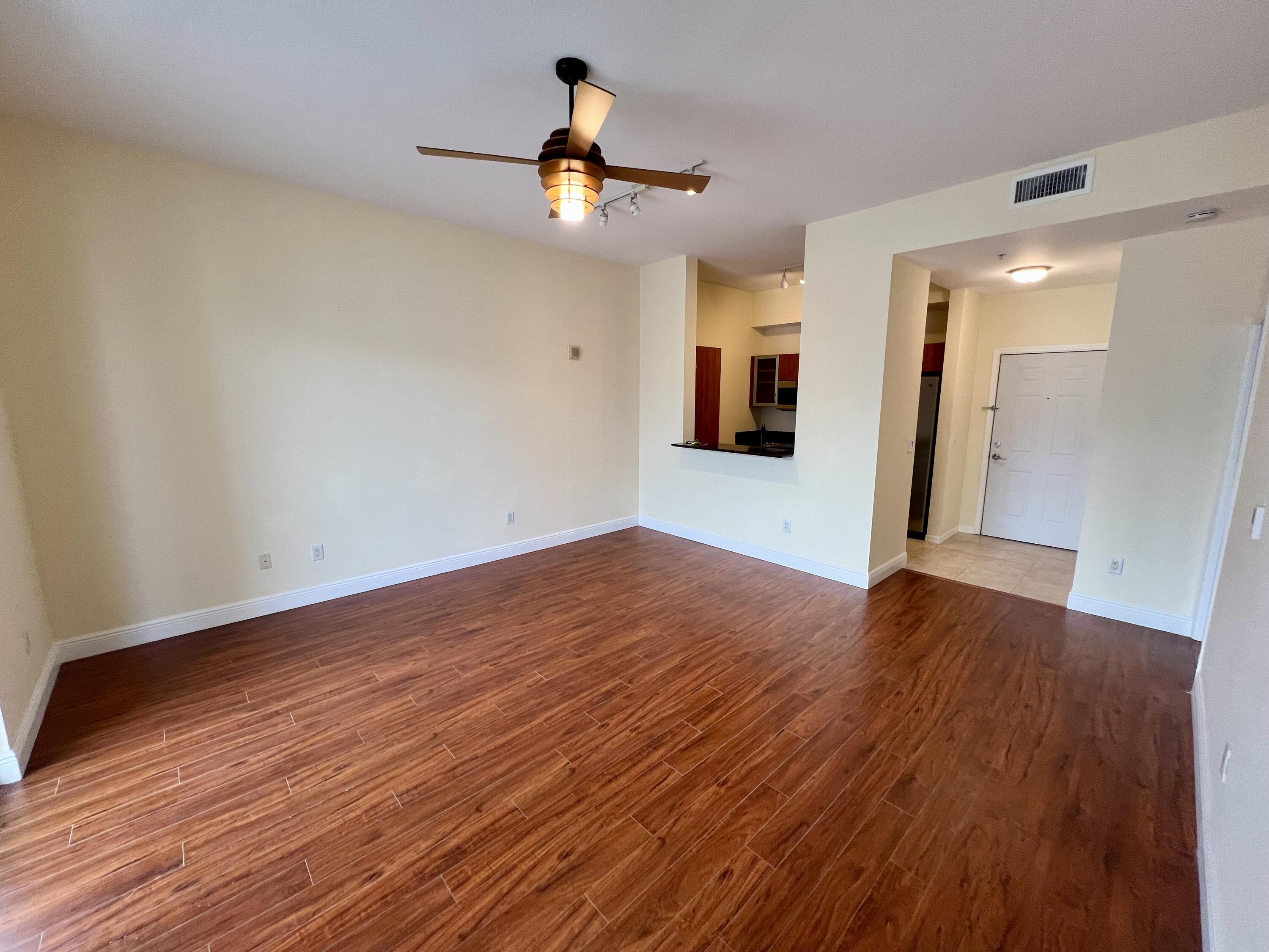 233 South Federal Highway, Unit UPH04 Boca Raton, FL 33432 - Photo 6 of 26 a view of empty room with wooden floor