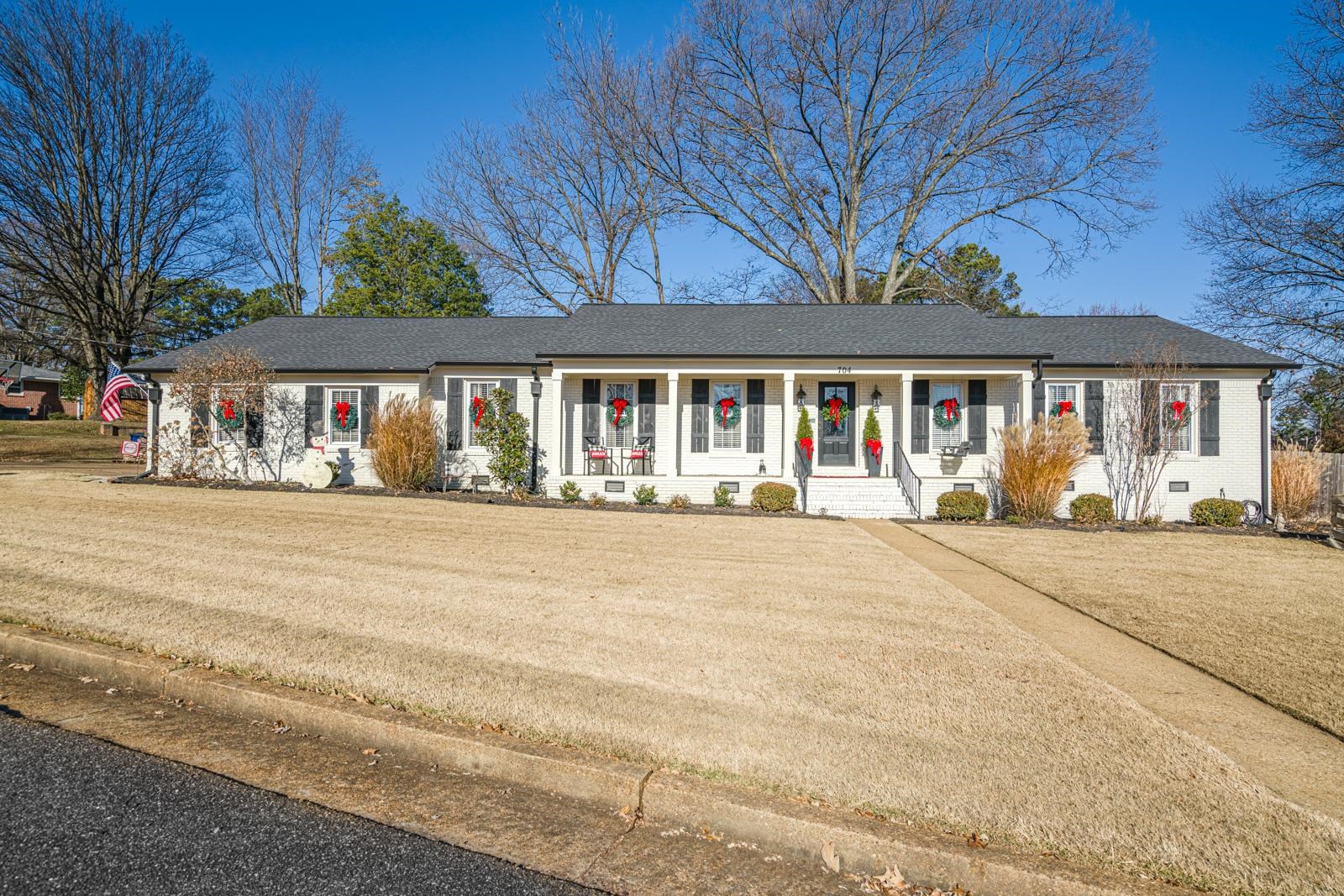 front view of a house next to a road