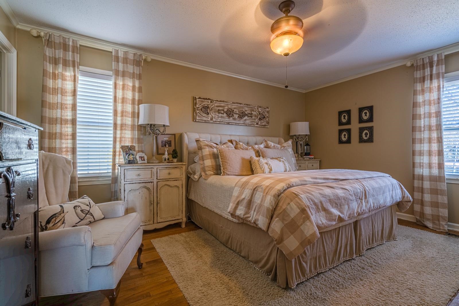 704 Irene Circle Covington, TN 38019 - Photo 16 of 31 a bedroom with a bed and a chandelier