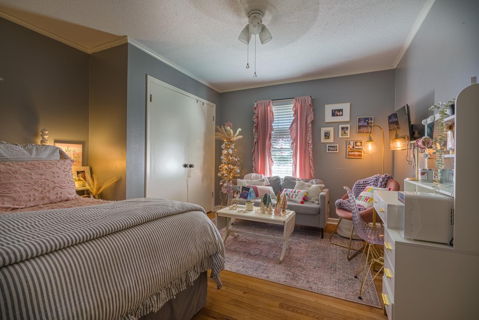 704 Irene Circle Covington, TN 38019 - Photo 18 of 31 a bedroom with a bed and wooden floor