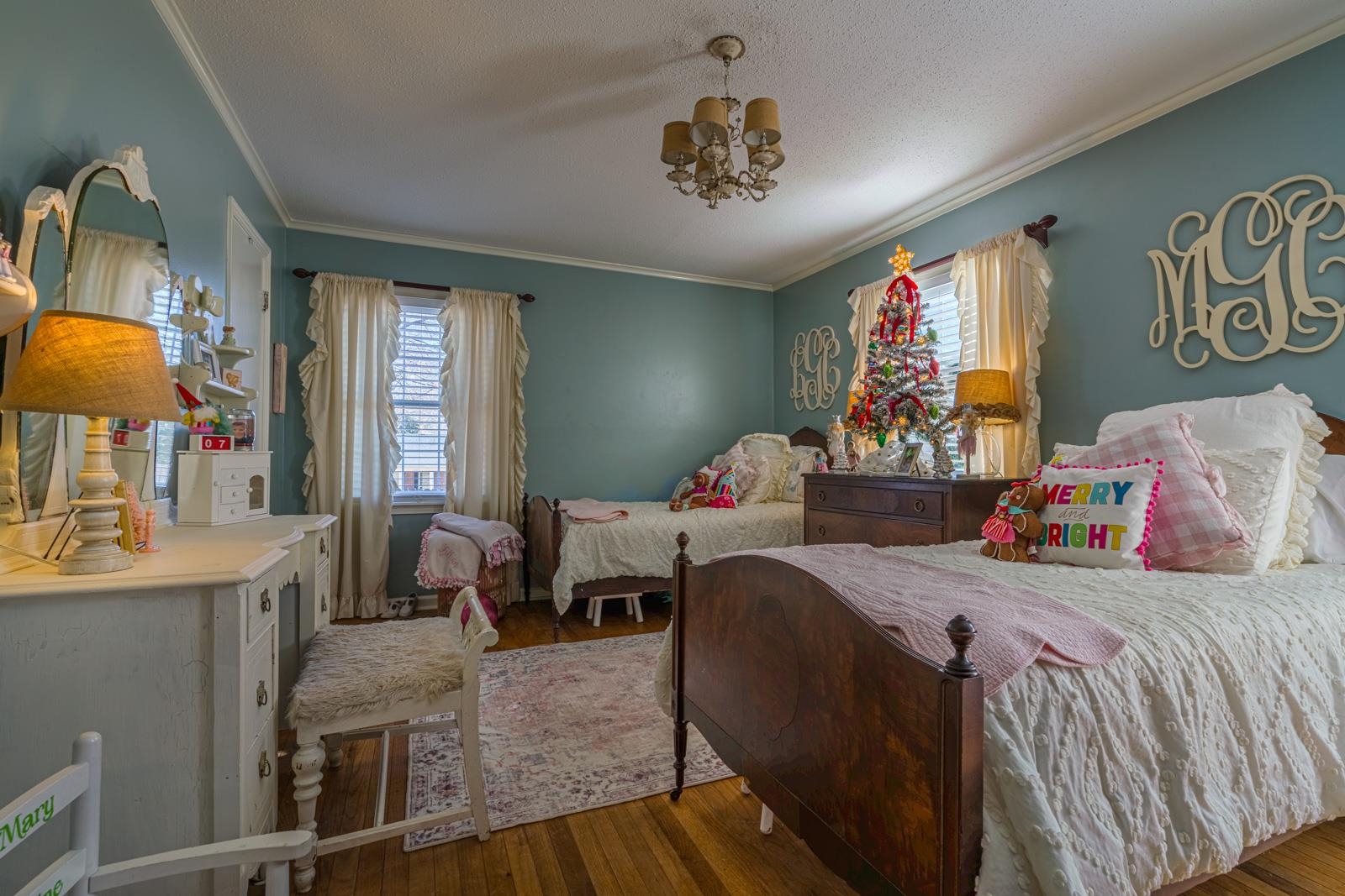 704 Irene Circle Covington, TN 38019 - Photo 20 of 31 a bedroom with a bed and a chandelier