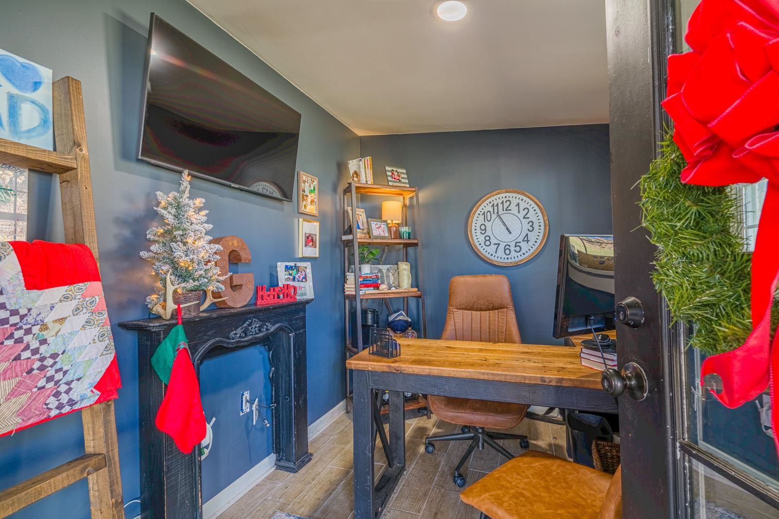 704 Irene Circle Covington, TN 38019 - Photo 26 of 31 a living room with furniture a flat screen tv and a wall clock