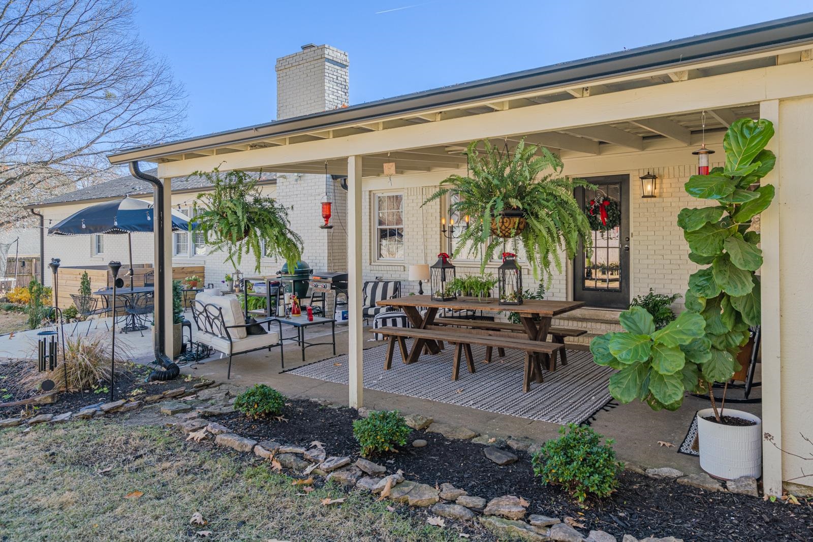 704 Irene Circle Covington, TN 38019 - Photo 28 of 31 a view of a patio with table and chairs potted plants