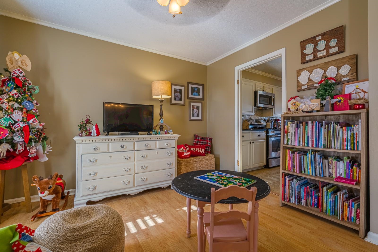 704 Irene Circle Covington, TN 38019 - Photo 7 of 31 a living room with furniture and a bookshelf